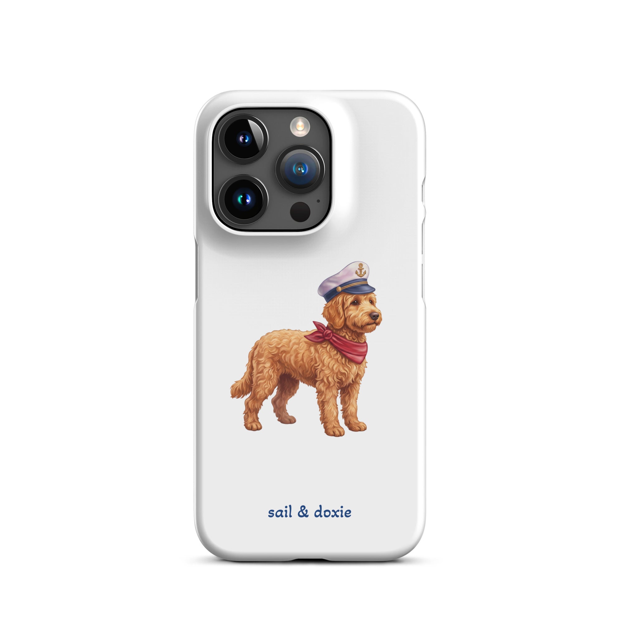 A white phone case featuring a printed illustration of a doodle dog wearing a captain's hat and red neck scarf, with the text 'sail & doxie' printed below in blue. The case is shown on a clean white background.