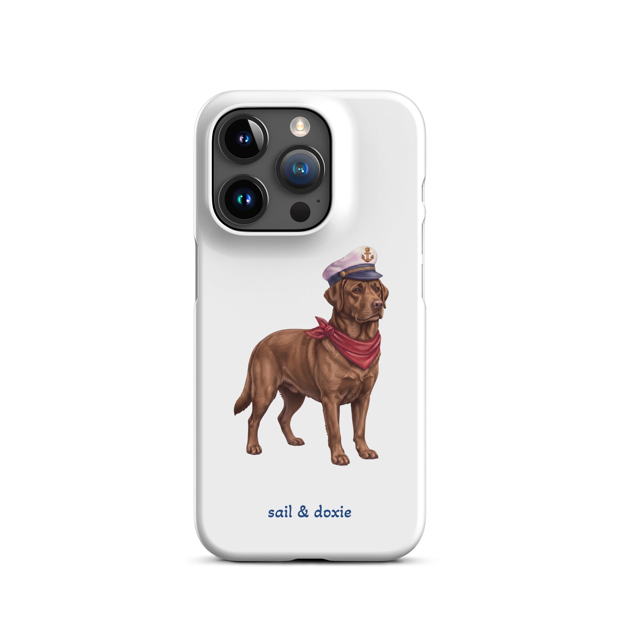 A white phone case featuring an illustration of a brown Labrador dressed as a sailor with a captain's hat and red neck scarf, with the text 'sail & doxie' printed below.