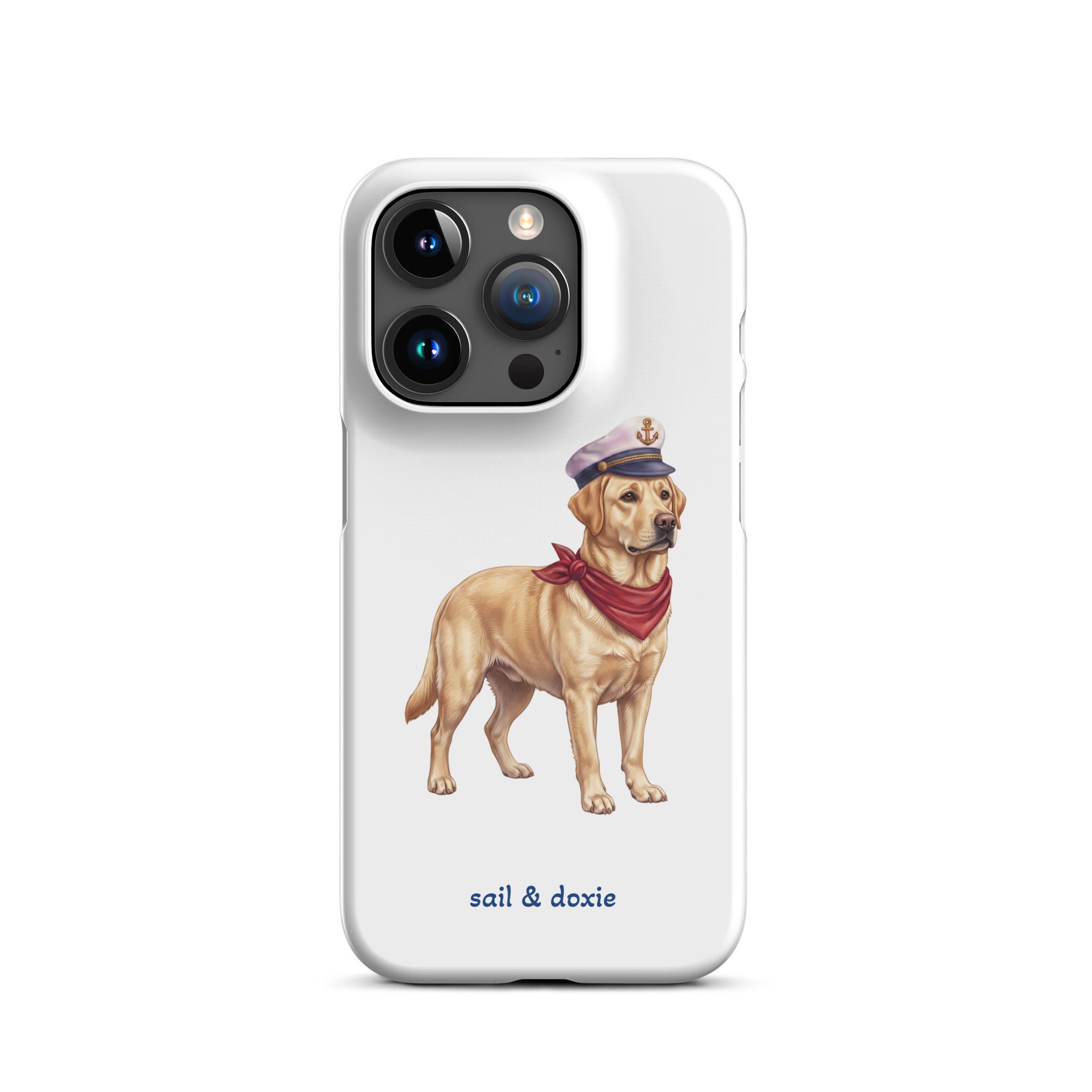 A white phone case featuring an illustration of a yellow Labrador dressed as a sailor with a captain's hat and red neck scarf, with the text 'sail & doxie' printed below.
