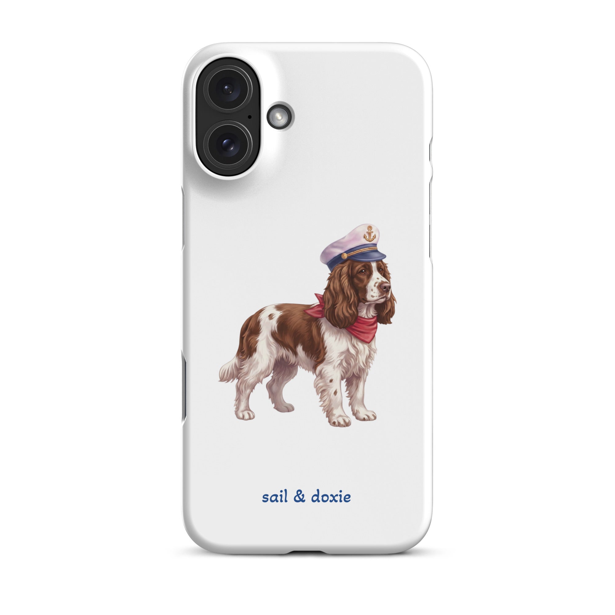 A white phone case featuring an illustration of a brown and white springer spaniel wearing a navy blue captain's hat and red neck scarf, with the text 'sail & doxie' printed in blue below. 