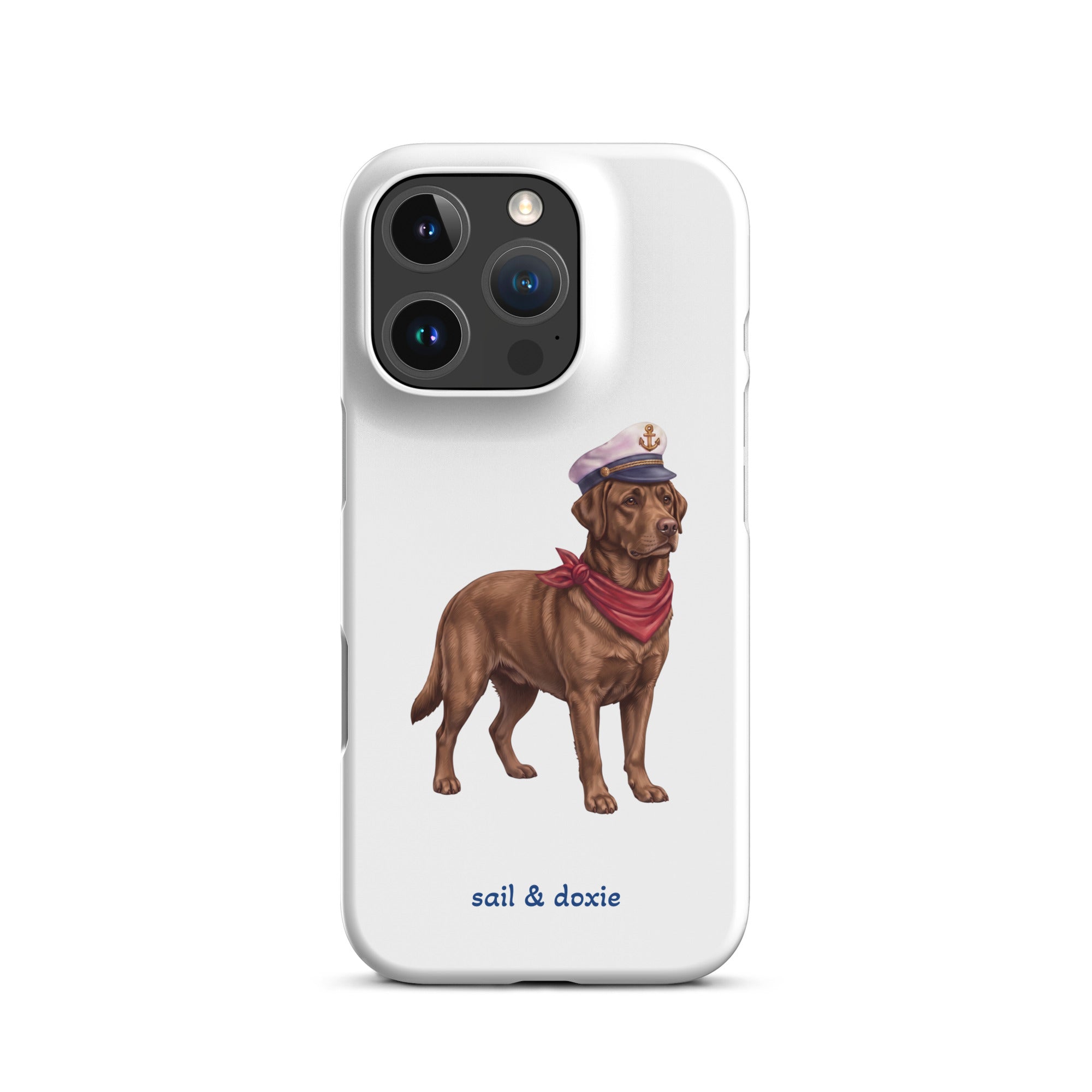 A white phone case featuring an illustration of a brown Labrador dressed as a sailor with a captain's hat and red neck scarf, with the text 'sail & doxie' printed below.