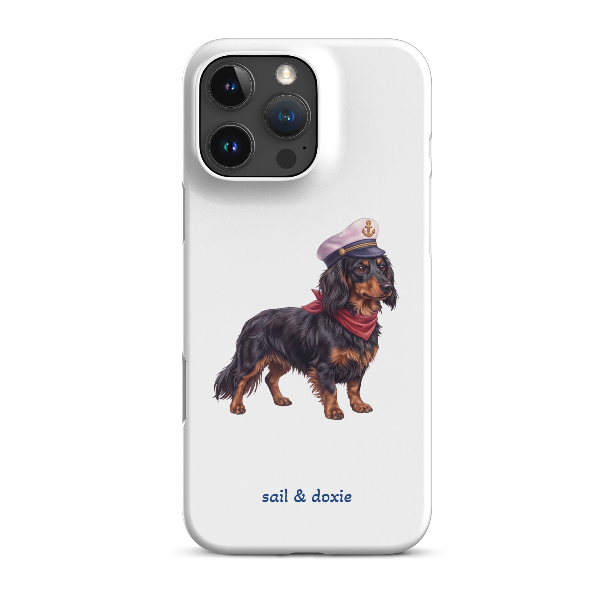 A white phone case featuring an illustration of a black and tan dachshund wearing a captain's hat and red neckerchief, with the text 'sail & doxie' printed below in blue. The case is shown on a clean white background.