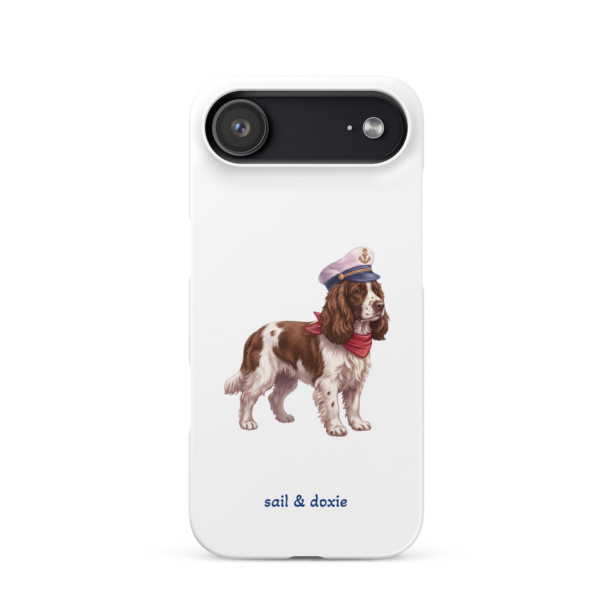 A white phone case featuring an illustration of a brown and white springer spaniel wearing a navy blue captain's hat and red neck scarf, with the text 'sail & doxie' printed in blue below. 