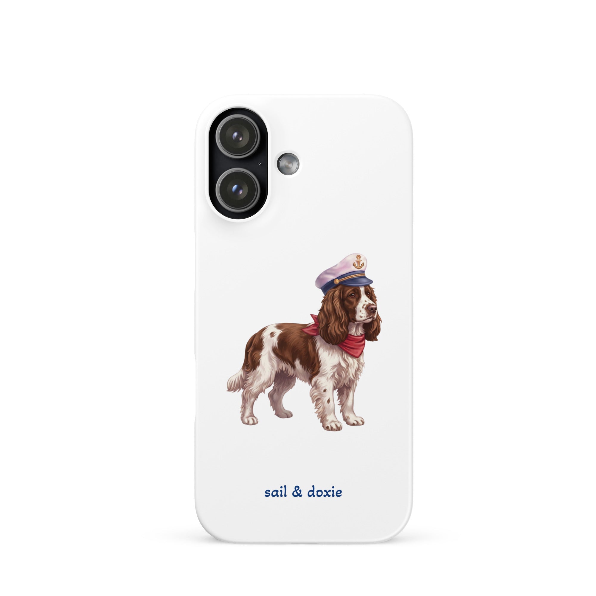 A white phone case featuring an illustration of a brown and white springer spaniel wearing a navy blue captain's hat and red neck scarf, with the text 'sail & doxie' printed in blue below. 