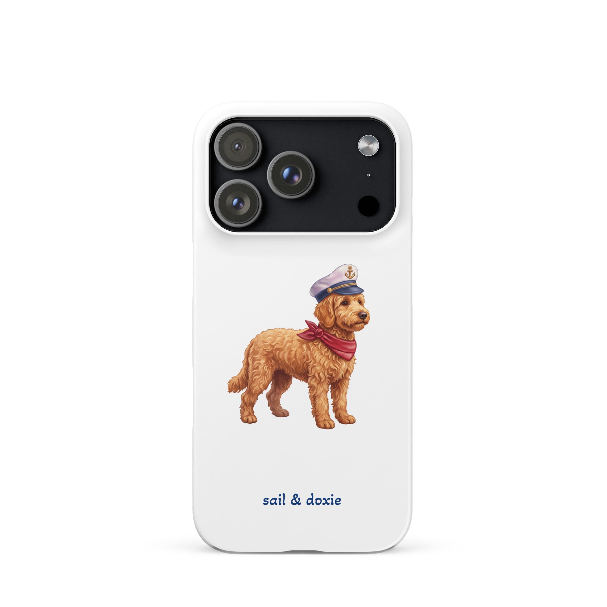 A white phone case featuring a printed illustration of a doodle dog wearing a captain's hat and red neck scarf, with the text 'sail & doxie' printed below in blue. The case is shown on a clean white background.
