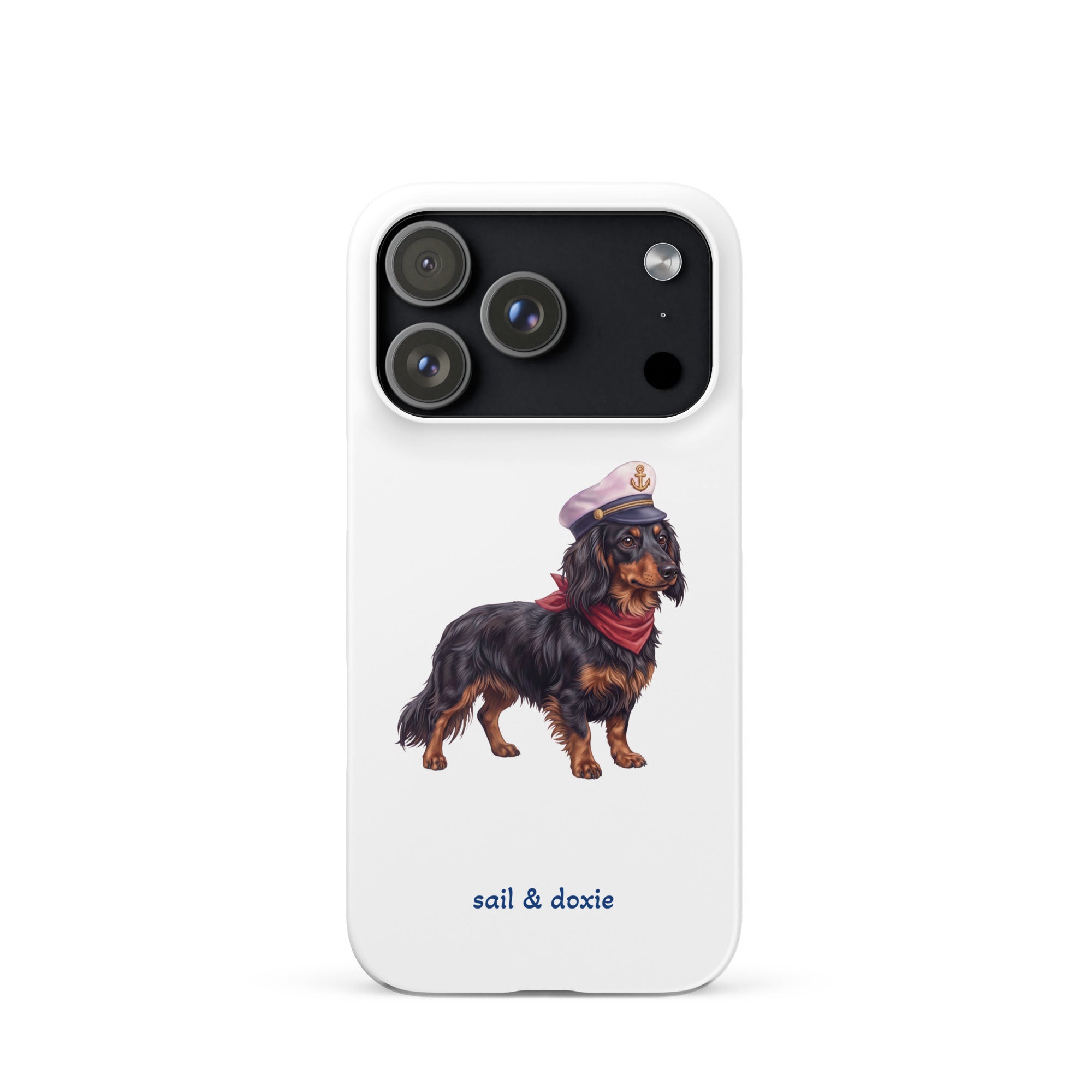 A white phone case featuring an illustration of a black and tan dachshund wearing a captain's hat and red neckerchief, with the text 'sail & doxie' printed below in blue. The case is shown on a clean white background.